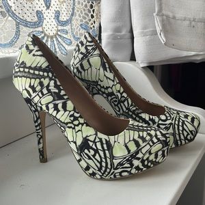 stiletto heel butterfly wings pattern in modeled light green and black.